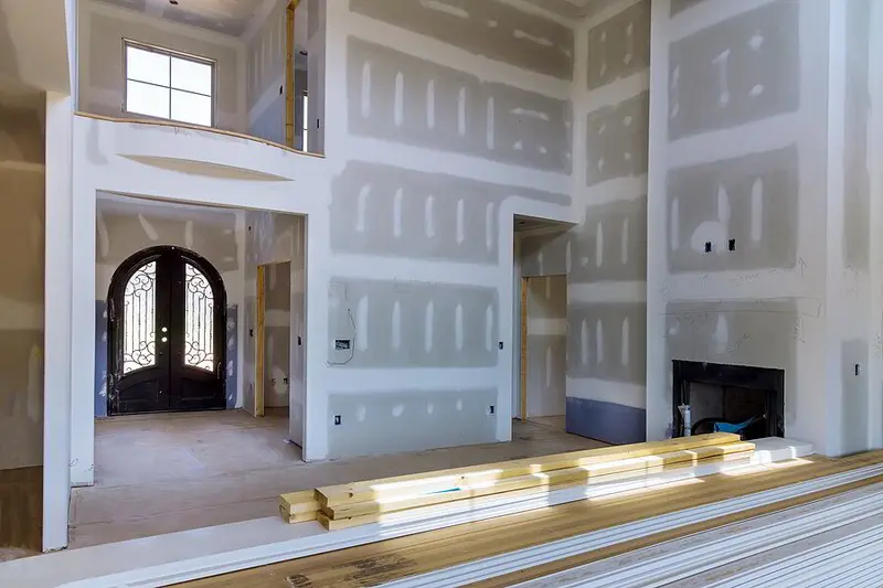 New drywall sheets hung on a framed wall during a Tampa Bay renovation