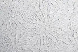 Side-by-side close-up of orange peel and knockdown drywall textures