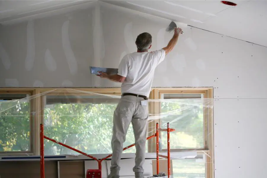 Modern drywall repair materials including setting compound, mesh tape and a vacuum sander