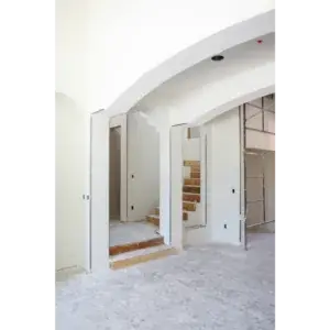 Fresh drywall sheets hung and taped in a home under renovation